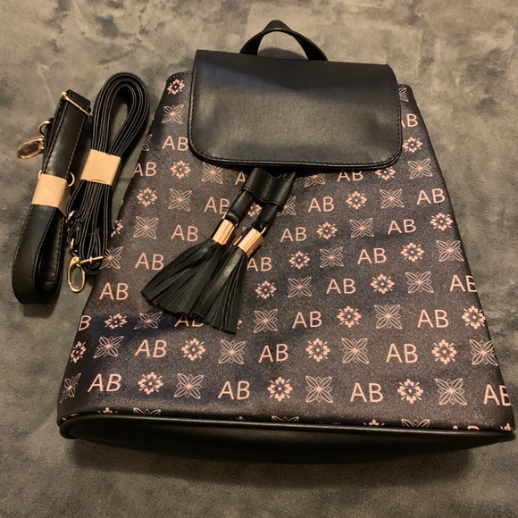 Handbags - Designer backpack that is also a crossbody.